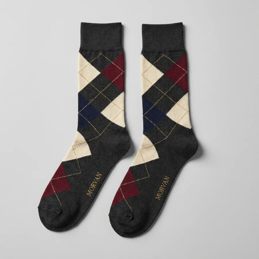 A pair of custom charcoal argyle dress socks with a woven MORVAN logo