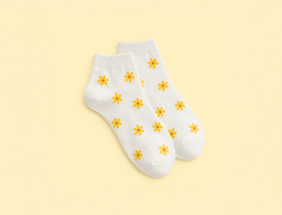 Custom white ankle socks with a yellow daisy pattern